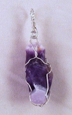 Custom made Sterling Silver wire wrapped Amethyst crystal hand crafted high in the mountains of Northern New Mexico by the artists at Alta Studios. Each piece is hand made - Item shipped may vary slighty from item shown in pictures. 8 oz. Shipping Weight * Necklace not included * Unique Amethyst Wire Wrapped Crystal Necklace, Spiritual Wire Wrapped Crystal Pendant, Handmade Bohemian Purple Crystals, Bohemian Wire Wrapped Crystals For Healing, Bohemian Wire Wrapped Healing Crystals, Handmade Amethyst Pendant Crystal, Wire Wrapped Crystals For Jewelry Making, Adjustable Hand-wrapped Amethyst Crystal Necklace, Purple Hand Wrapped Crystal Necklaces For Healing