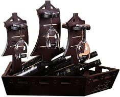 a wooden pirate ship with wine glasses and bottles in it