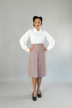 Wide-cut, calf-length skirt with a wide waistband in 40s style. It has a deep box pleat at the front and back. The skirt is lined, All models are made in my studio in Berlin. Outer fabric: 100% virgin wool Dry cleaning Size 34: Bust 80 cm, waist 64 cm, hips 86 cm Size 36: Bust 84 cm, waist 68 cm, hips 90 cm Size 38: Bust 88 cm, waist 72 cm, hips 94 cm Size 40: Bust 92 cm, waist 76 cm, hips 98 cm Size 42: Bust 96 cm, waist 80 cm, hips 102 cm Size 44: Bust 100 cm, waist 84 cm, hips 106 cm Size 46: Semi-formal Relaxed Pencil Skirt With Lining, Semi-formal Fitted Flared Skirt, Fitted Flared Skirt For Semi-formal Occasions, Classic Fitted Midi Skirt, Classic Knee-length Skirt With Pleated Waist, Elegant High Waist Pleated Skirt For Formal Occasions, Elegant Full Skirt With Fitted Waist, Classic Lined Skirt With Relaxed Fit, Classic Relaxed Fit Lined Skirt