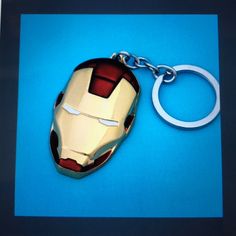 the iron man mask key chain is on display