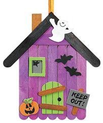 a purple house with a ghost on the roof and a sign that says keep out