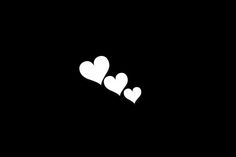 three white hearts on a black background