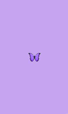 a purple butterfly flying in the sky