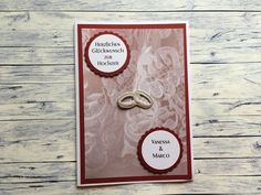 a wedding card with two rings on it