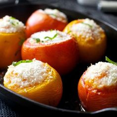 several oranges with cheese on them in a pan