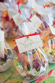 small plastic bags filled with different types of candies and food in them on top of a table