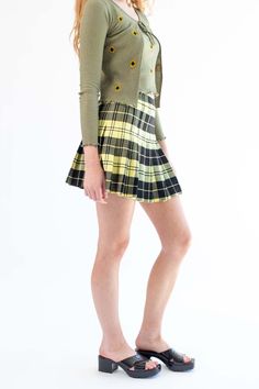 Yellow Plaid Pleated Skirt Casual Fitted Plaid Mini Skirt, Casual Plaid Mini Pleated Skirt, Trendy Plaid Mini Skirt, Trendy Plaid Skirt, Trendy Plaid High-waist Mini Skirt, Fitted Plaid Mini Skirt For Spring, Casual Plaid Mini Skirt With Lined Detail, Casual Plaid Mini Skirt With Lining, Casual Plaid Mini Tennis Skirt