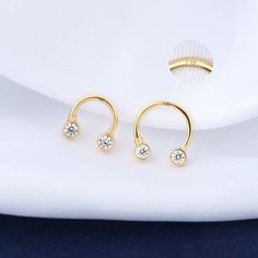 Description: Shiny Design: The 14K solid gold septum ring with shiny clear CZ, is simple and elegant for daily jewelry. Safe Material: Made of 14K gold, can be used as the first piercing. Smooth Surface: High polished smooth surface, comfortable for wearing without sharp edge and no irritation to your skin. Standard Size: The bar thickness is 16G(1.2mm), and the inner diameter is 8mm or 10mm. Please choose carefully according to your piercing size. Multiple Usage: It works so well in multiple pi Piercing Surface, Gold Septum, Septum Hoop, Daith Earrings, Helix Earrings, Daily Jewelry, Septum Piercing, Pave Ring, Tragus