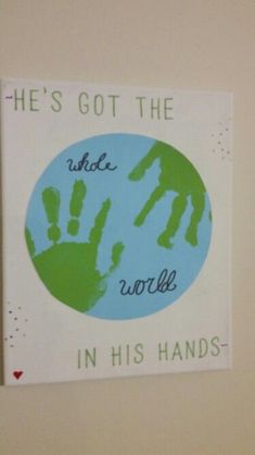 there is a sign that says he's got the whole world in his hands