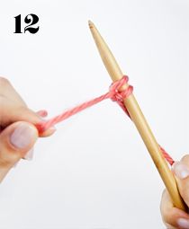 two hands crocheting the end of a piece of yarn with a wooden knitting needle