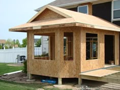 a house being built in the middle of a yard