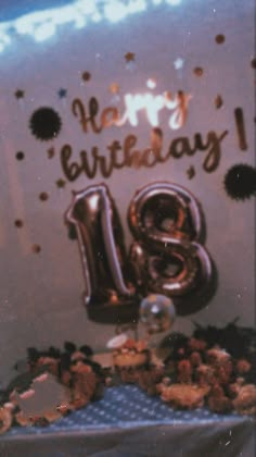 a birthday cake with the number thirteen on it and some confetti sprinkles