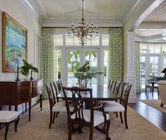 a dining room with a piano in the corner