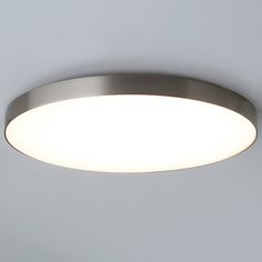 a circular light fixture on the wall