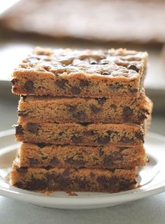 a stack of cookies sitting on top of a white plate