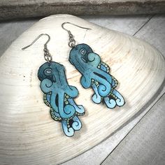 "These Large Blue Octopus Earrings are original Ink & Watercolor paintings hand painted on 1mm thick Italian Pressed Cotton Watercolor Paper. I paint the front and the back in full detail using Archival Pigma Ink and Inktense Watercolors. After painting, I  coat them in two layers of protective lacquer, making them UV-Resistant and Water Resistant. Once complete, they have almost no weight. All hardware is hypoallergenic Stainless Steel of Gold-Finished Stainless Steel. MADE TO ORDER Size: 2.5\" Diy Shrink Plastic Jewelry, Shrinky Dink Art, Sea Creature Jewelry, Shrinky Dink Crafts, Shrinky Dink Jewelry, Octopus Earrings, Blue Octopus