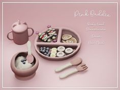 a pink bowl with spoons and other items in it