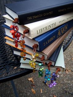 a stack of books sitting on top of a metal table