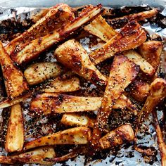 baked french fries with seasoning in a pan