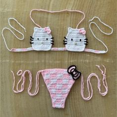 two crocheted hello kitty swimsuits with matching headbands