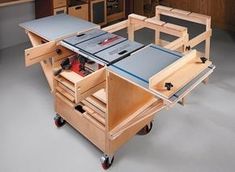 a workbench with drawers and tools in it