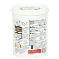 a white bucket with the label limewash on it