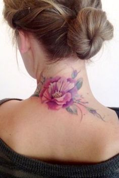 a woman with a flower tattoo on her neck