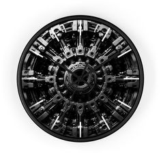 a black and white photo of a clock with many gears on it's face