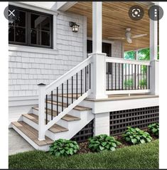 a white house with a porch and stairs