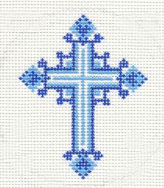 the cross is made up of blue and white beads, which are stitched together