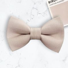 Almond Bow Tie & Brown Suspenders are PERFECT for a biscotti bow tie, champagne bowtie for groomsmen, ring bearer gift, boho wedding or any other special occasion!**Compliments Birdy Grey's AlmondX-Small: 6 months- 2 yearsSmall: 3 years- 5 yearsMedium: 6 years- 10 yearsLarge: 10 years- Up To 6ft tallAdult: Adults Over 6ft Tall//SHIPPING//VERY IMPORTANT: Time to make and ship your order can be found under the shipping information with each item. :)**FIRST CLASS MAIL (default) takes 2-5 business d Classic Pink Bow Tie For Party, Classic Adjustable Bow For Groom, Classic Wedding Bow, Summer Wedding Bow Tie With Detachable Bow, Classic Fitted Bow For Groom, Groomsmen Ring, Tan Bow Tie, Bow Tie Groomsmen, Ring Bearer Gift