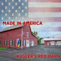 a red barn with an american flag in the background and text that reads made in america kugler's red barn