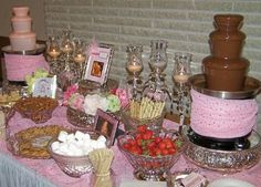 a table topped with lots of desserts and wine glasses