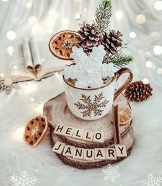 a coffee cup filled with cookies and flowers