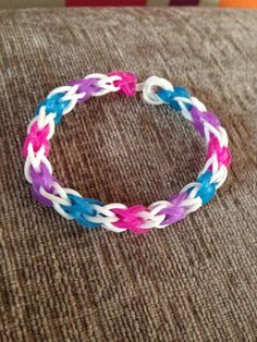 a colorful bracelet sitting on top of a couch