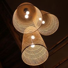 three lights hanging from the ceiling in a room