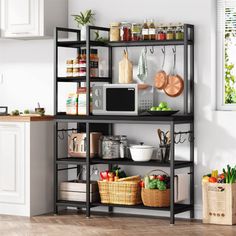 a kitchen with white walls and wooden flooring, shelves filled with various items on top of each shelf