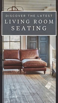 a brown leather couch sitting on top of a wooden floor