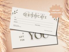 a gift certificate is laying on top of some dry grass with the words, gift for you