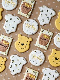 baby shower cookies with winnie the pooh ones on them