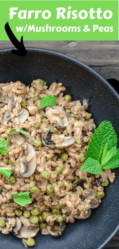 mushroom and peas risotto in a black bowl with mint leaves on the side