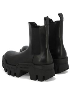 Step up your style game with these chunky Chelsea boots, featuring a thick toothed rubber outsole and a comfortable pull-on design. The round toe and 8cm platform add a touch of edginess, while the elastic sides and leather back pull-on loop make them easy to slip on and off. Pull-on design for easy wear Thick toothed rubber outsole for added grip Chunky platform design for a bold look Elastic sides and leather back pull-on loop for convenience Balenciaga logo embossed on exterior outsole for a Chunky Chelsea Boots, Platform Design, Black Balenciaga, Balenciaga Logo, Black Chelsea Boots, Prada Designer, Chunky Platform, Casual Bags, Easy Wear