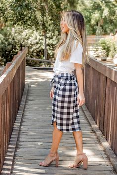 Looking for a weekend skirt that's both cozy and stylish? Look no further than our Buffalo Plaid Weekend Skirt! This skirt is the perfect combination of cute and comfortable, with a knee-length cut and a self-tie waistband that'll keep you feeling feminine and put-together all day long. Whether you're running errands or meeting up with friends for brunch, this skirt is sure to turn heads. And with sizing options ranging from S to 3X, it's easy to find the perfect fit for your body type.So why wa Casual Pencil Skirt For Fall, Fall Day Out Bottoms With Tie Waist, Fall Bottoms With Tie Waist For Day Out, Fall Tie Waist Bottoms For Day Out, Casual Mini Skirt For Daywear, Trendy Pencil Skirt For Day Out, Casual Relaxed Skirt For Daywear, Casual Skirt With Elastic Waistband For Day Out, Casual Tie Waist Skirt For A Day Out