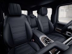 the interior of a truck with black leather seats