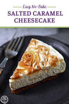 a piece of cheesecake on a black plate with a fork and knife next to it