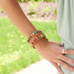 Two rows of colorful Kantha beads bookend a row of braided Sari textiles. Each is accented with matte gold seed beads for a subtle pop of shimmer. Made from repurposed Kantha textiles so the colors and patterns will vary slightly. Sustainably handmade by women artisans in India. Bohemian Multicolor Fair Trade Beaded Bracelets, Multicolor Bohemian Beaded Bracelets Fair Trade, Multicolor Woven Beaded Bracelets, Gold Woven Beaded Bracelets, Spiritual Multicolor Beaded Bracelets With Gold Beads, Casual Handwoven Multicolor Beaded Bracelets, Casual Multicolor Handwoven Beaded Bracelets, Plaits, Women Artisans