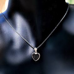 Hearts symbolize love and commitment, giving this delicate, brightly polished pendant necklace added meaning along with pure style. A black cubic zirconia inlay is set in the middle framed by a heart-shaped halo beautifully centered on a shiny black cable chain made of sterling silver. This lovely necklace is made of oxidized silver and the heart has 2 sides, one with black zircons and one with white zircons, so you basically have 2 necklaces for the price of one. DETAILS - 925 Sterling Silver Heart Halo, Halo Necklace, Heart Choker, Black Choker, Lovely Necklace, Necklace Black, Black Heart, Elegant Jewelry, Heart Necklace