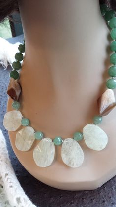 "One strand beaded necklace made with faceted jade, pyramid onyx and opulite teardrops.measuring about 1 1/4\" long and 1\" wide. This gorgious necklace measures 19\" long. Looks great with lots of outfits. If you like it \" pin it \" or share on Facebook." Bohemian Jade Necklace With Faceted Beads, Healing Jade Necklace With Large Beads, Faceted Jade Round Bead Necklace, Unique Jade Gemstone Beaded Necklaces, Unique Jade Beaded Necklaces With Gemstone Beads, Adjustable Jade Necklace With Large Beads, Adjustable Jade Jewelry With Large Beads, Jade Beaded Oval Necklaces, Jade Faceted Beads For Jewelry Making