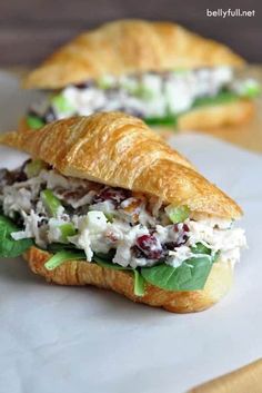 a croissant sandwich with chicken salad on it