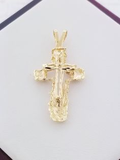 "Beautiful solid yellow gold cross. This piece features a cross with diamond cut design. This piece is brand new! Details: Style: Cross Weight: 2.0 grams Length: Appx. 1 1/4\" including bail Width: Appx. 1/2\" Metal: 14k Yellow Gold Condition: Brand new! The back of the pendant is stamped with '14k'. PACKAGING: Each item comes in a jewelry box and wrapped beautifully as a gift. If you would like us to include a gift note in the parcel, please leave us a message with your order about the content Gold Cross Pendant, Gold Cross, New Details, Cut Design, Solid Yellow, Diamond Cut, Cross Pendant, Online Jewelry, Precious Metals